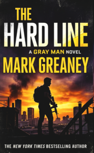 Explosive & Relentless: Mark Greaney’s The Hard Line (2026) Raises the Bar for Espionage 8 Delusional Book cover of The Hard Line by Mark Greaney featuring a dark tactical silhouette of a man standing against a fiery orange and black urban sunset, with bold white and yellow typography.