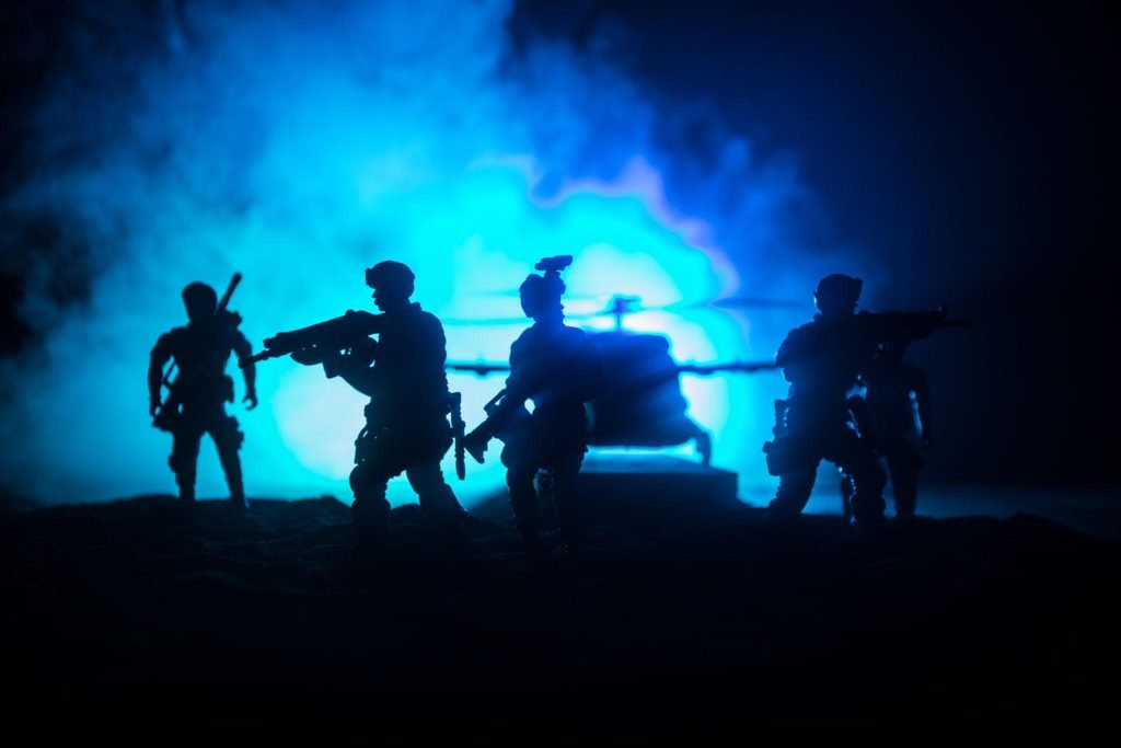 Unlocking Shadow Strike (2026): Why Brad Taylor’s Thriller Is the Ultimate Entry Point for New Readers 4 shadow strike Special forces soldiers advancing through a nighttime desert environment, illustrating Shadow Strike's combat and suspense elements.